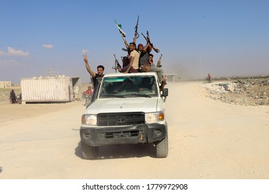 Aleppo, Syria 16 October 2016:
Syrian Opposition Fighters Raise Their Hands Of Victory Over The Military Vehicles After The Victory Over ISIS