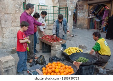 Aleppo/ Syria - April 13, 2009: Ordinary Life In Front Of The Gate Of Madina Souq Before The Syrian Civil War.