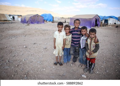 Aleppo, Syria - December 2016: A children at Refugee camp near the village outside Aleppo city in Syria