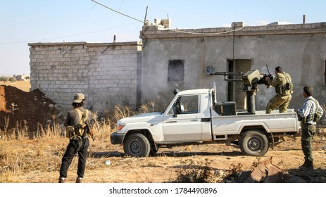 Aleppo, Syria March 14, 2016:
Syrian Armed Opposition Soldiers Open Fire With Heavy Weapons Towards ISIS Fighters.
Sparks And Fire Smoke