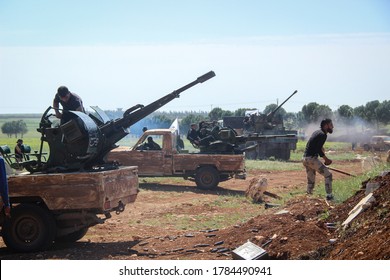 Aleppo, Syria March 14, 2016:
Syrian Armed Opposition Soldiers Open Fire With Heavy Weapons Towards ISIS Fighters.
Sparks And Fire Smoke