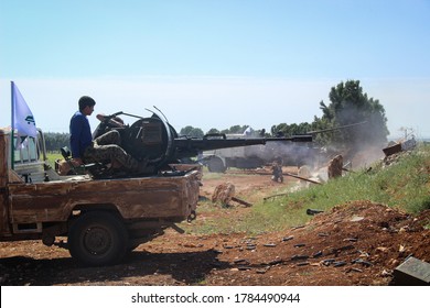 Aleppo, Syria March 14, 2016:
Syrian Armed Opposition Soldiers Open Fire With Heavy Weapons Towards ISIS Fighters.
Sparks And Fire Smoke