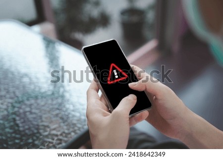 Alert message mobile notification, Emergency alert, Data network protection, Virus alarm, Wireless technology concept. Person using mobile smartphone and receive warning alert show on screen.
