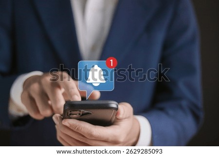 Alert notification concept. Reminder, Push Notifications, Web Reminders, Time Table and Announcements. Person using smartphone with bell notification icon on virtual screen.