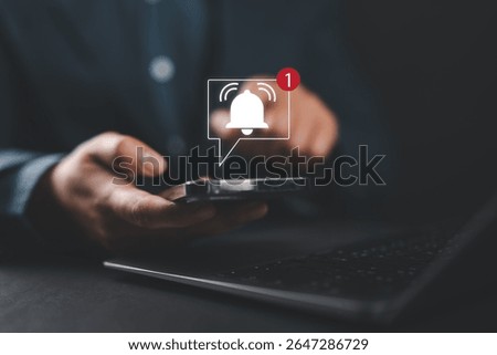 Alert notification concept. Reminder, Push Notifications, Web Reminders, Time Table and Announcements. Businessman using smartphone with bell notification icon on virtual screen.