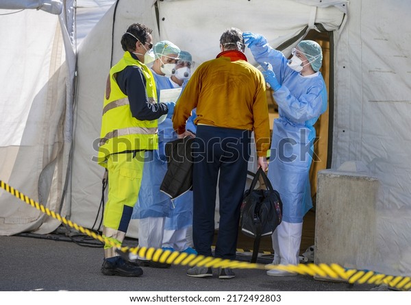 Alert Omicron 5 variant for pandemic\
Covid-19. Triage hospital field tent for the first AID, a mobile\
medical unit for patient infected with Corona Virus. Doctors check\
the patiences at the\
entrance.	