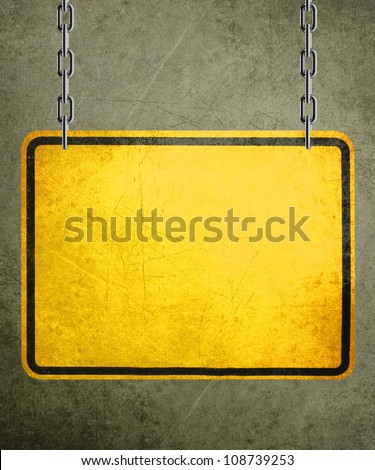 Alert yellow sign hanging by metal chain, conceptual image for under construction and coming soon