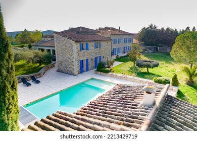 Ales, France - March 24th 2022 : Aerial View With Drone Of A Large Stoned Villa In The South Of France With Its Large Garden, Pool During A Sunny Day