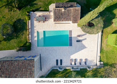 Ales, France - March 24th 2022 : Aerial View With Drone Of A Large Stoned Villa In The South Of France With Its Large Garden, Pool During A Sunny Day