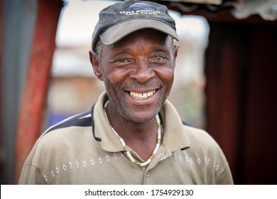 Alexandra Township / South Africa - October 30, 2013: A man smiles for a picture in a Township of South Africa.