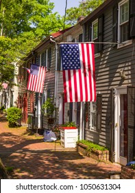 ALEXANDRIA, VIRGINIA, USA - MAY 12, 2009: American flags and historic houses on Queen Street in Old Town.