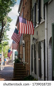 Alexandria, Virginia/ USA- May 21, 2020: Old Town Alexandria houses with American flags hung up.
