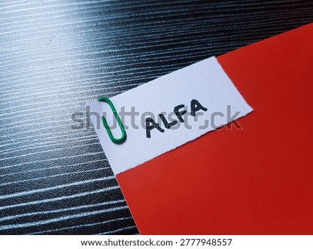 Alfa writting on table background. 