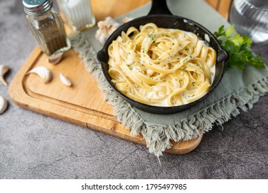 Alfredo Pasta Dinner With Creamy White Sauce And Herbs