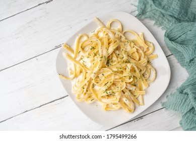 Alfredo Pasta Dinner With Creamy White Sauce And Herbs