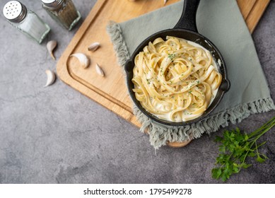 Alfredo Pasta Dinner With Creamy White Sauce And Herbs