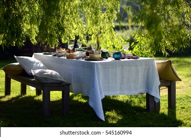 Alfresco Dining, Table Set For An Evening Meal Outside