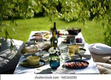 Alfresco Dining, Table Set For An Evening Meal Outside