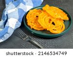 algeria sweet food named zlabia, in Inde named Jalebi, it is prepared with flour and yogurt and honey and other ingredients