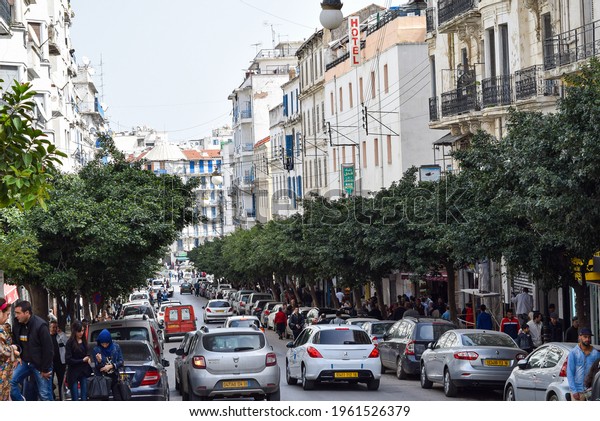 Algiers, Algeria - March\
21, 2015: Traffic jams and walking people in Algiers. Crowded\
capital city.