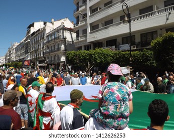 Algiers, Algeria - May 31st 2019 : Algerians Of Different Ages And From All Walks Of Life Participate In Anti-regime Demonstrations For The Fifteenth Friday. Here, A Large Flag Can Be Seen.