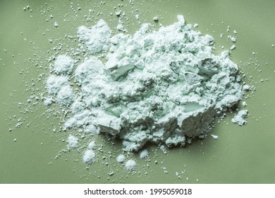 Alginate Mask Powder Or Green Clay Bentonite Powder, Dry Body Wrap Sample Texture On Green Background. Skin Care, Body Care Concept.