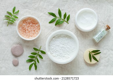 Alginate mask, sea salt and skin care face cream on light background, top view - Shutterstock ID 2128571723