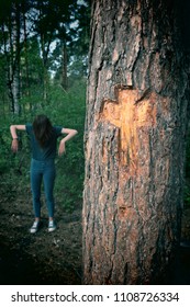 Algiz Sign Rune, Carved On A Pine. Peace, Protection From Evil Forces. In The Background Is A Paranormal Phenomenon, A Witch.