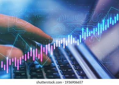 Algorithmic trading concept with virtual screen with growing stock market candlestick and circuit at laptop with hands background. Double exposure