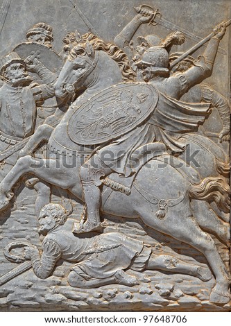 Alhambra, wall of Carlos V Palace. Relief carving of a battle scene.