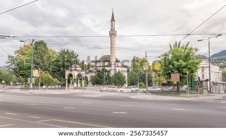 Ali Pasha Mosque timelapse hyperlapse with traffic on intersection, It was completed in 1561 after plans of Hadim Ali Pasha, Sarajevo, Bosnia and Herzegovina.