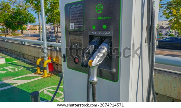 Alicante, AlicanteEspaña; 11 15 2021 : Iberdola\
electric car recharging station in outdoor parking lot of shopping\
center