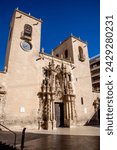 Alicante, Alicante - Spain - 01-07-2024: Baroque facade of Santa Maria Basilica in Alicante featuring elaborate ornamentation, towering columns, and intricate sculptures