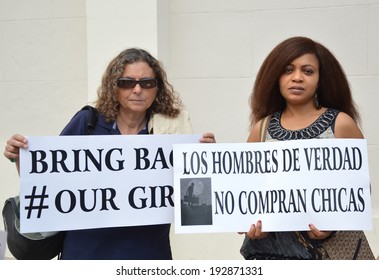 ALICANTE, SPAIN - MAY 14: Two Women At Protest March Holding Signs For Release Of Girls Taken By Terrorists Boko Haram In Chibok Gov. School. Organized By Assn Of Nigerians In Alicante May 14, 2014.