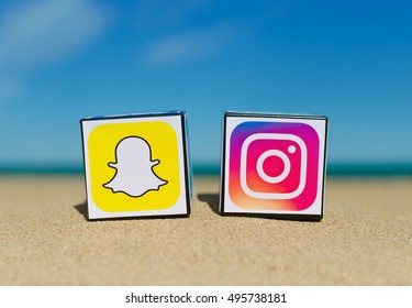 Alicante, Spain - September 15, 2016: Cubes With Logotypes Of Social Media: Instagram, Snapchat  Placed In The Sand Against The Sea.