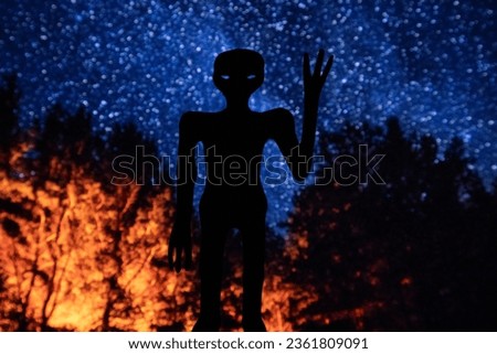 “The Alien from Nazca”. My art about world’s first official event on extraterrestrial life. Mexican alien from Nazca, Peru. The alien silhouette on the starry night background.