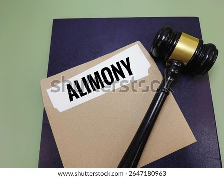 Alimony Document on Paper Inside Brown Envelope with Judge Gavel on Book Representing Divorce Settlement, Legal Obligation, Family Law, Spousal Support, and Court Decision. 
