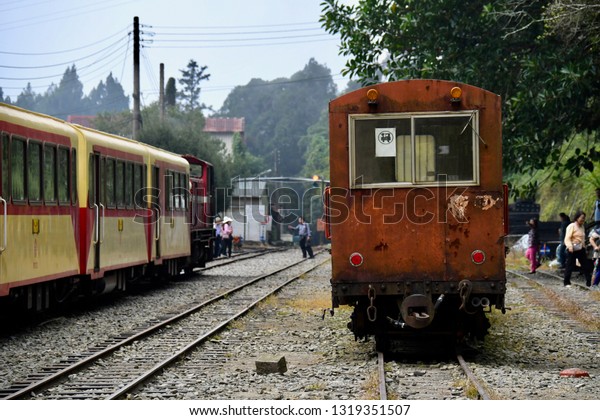 ALISHAN NATIONAL SCENIC AREA, TAIWAN - OCTOBER\
1,2018: The old historical type of train for the passengers travel\
to Alishan national scenic,\
Chiayi