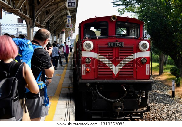 ALISHAN NATIONAL SCENIC AREA, TAIWAN - OCTOBER\
1,2018: The old historical type of train for the passengers travel\
to Alishan national scenic,\
Chiayi