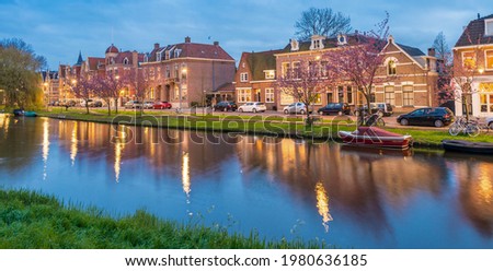 Alkmaar, Netherlands. Beautiful night view of homes over canal.
