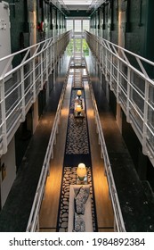 Alkmaar, The Netherlands-June 2021; High Angle View Into Hallway With Prison Cells Of Former Prison Now Renovated Boutique The Fallon Hotel Retaining The Original Interior Features