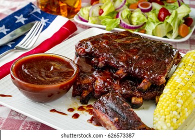 All American Picnic With Bbq Ribs And Whiskey Bourbon Bbq Sauce With Ear Of Corn And Fresh Salad Side Dish