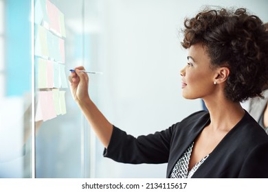 It all began with one idea. Shot of a businesswoman making notes on a glass board. - Powered by Shutterstock