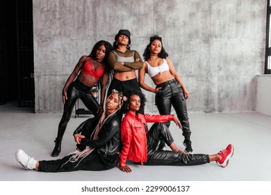 An all female diverse hipster dance team is in the studio after practicing their dance routine. - Powered by Shutterstock