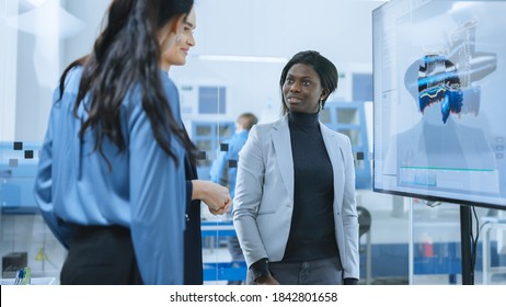 All Female Team: Automotive Designer, Chief Engineer, And Manager Use Digital Interactive Whiteboard That Shows 3D Jet Engine Concept. Developers Find Problem Solution. Factory Meeting Room