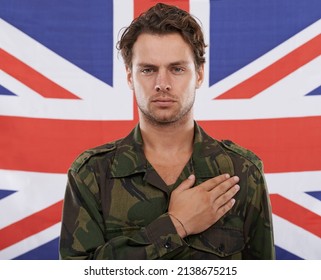 All For His Country. An English Soldier With His Hand On His Heart.