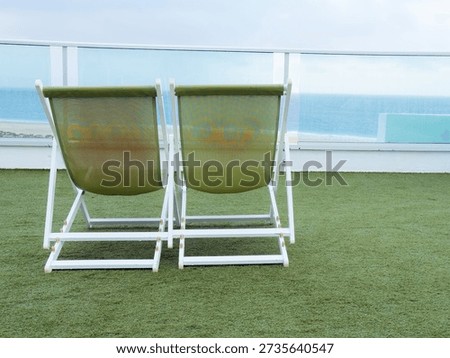 All Inclusive Vacation Concept with Empty Deck Chairs