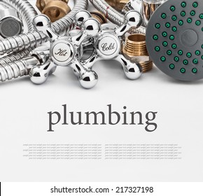 All kinds of plumbing and tools on a gray background. Empty white space above and below for sample background and text