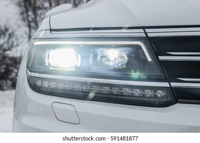 All LED adaptive headlight of a modern car. Headlight consists of individual matrix LED units that can be switched on, off or dimmed, depending on driving conditions.