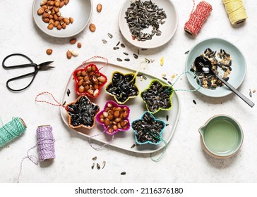 All Of Muffin Pans Filled With Fat Melted Coconut Fat And Birdseeds.   Easy Homemade Bird Feeder Kids Craft And Helping Wild Animals Concept. Top View.